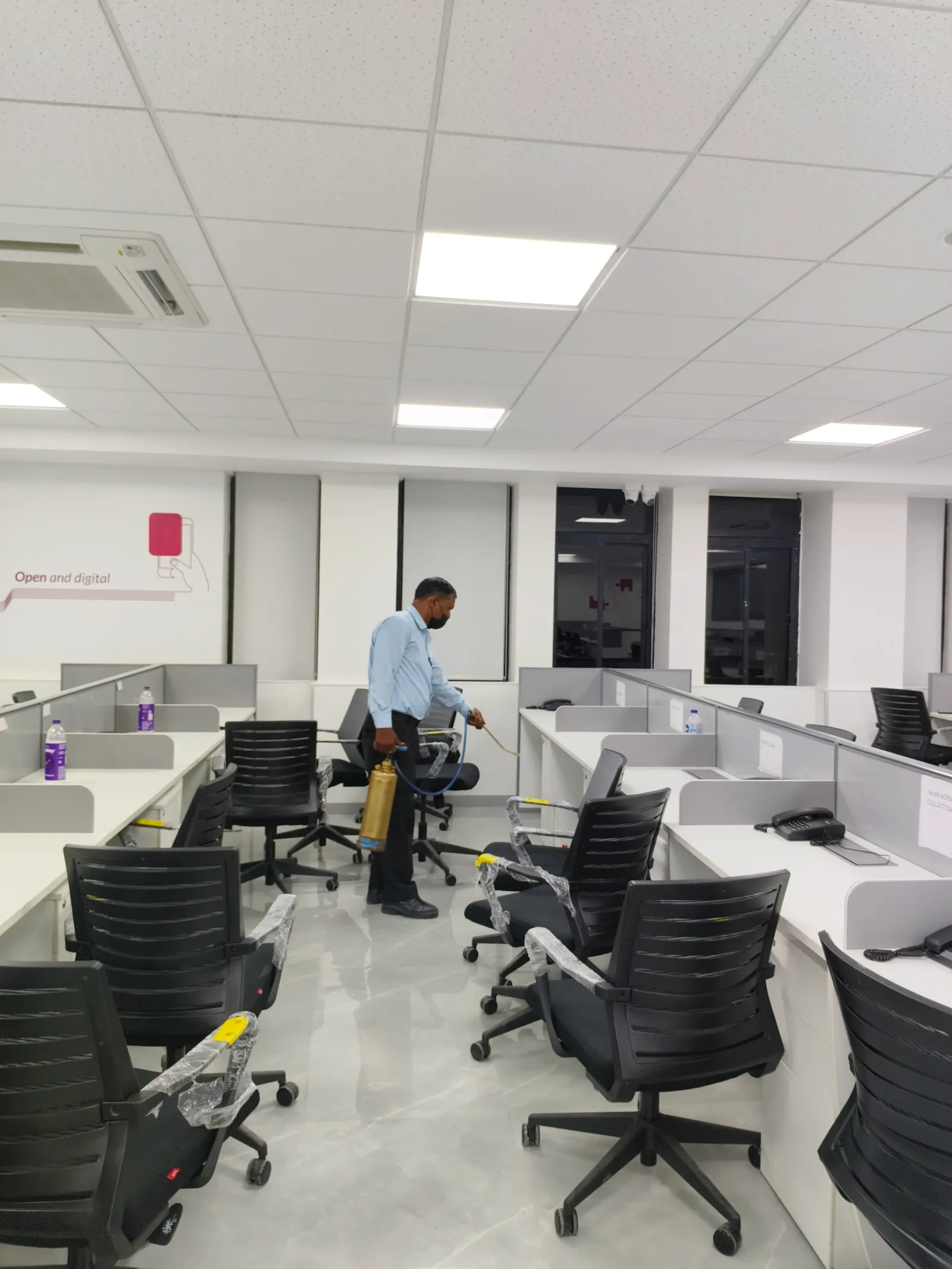 Technician spraying for mosquitoes in a commercial office near Lanka Gate, Bundi.