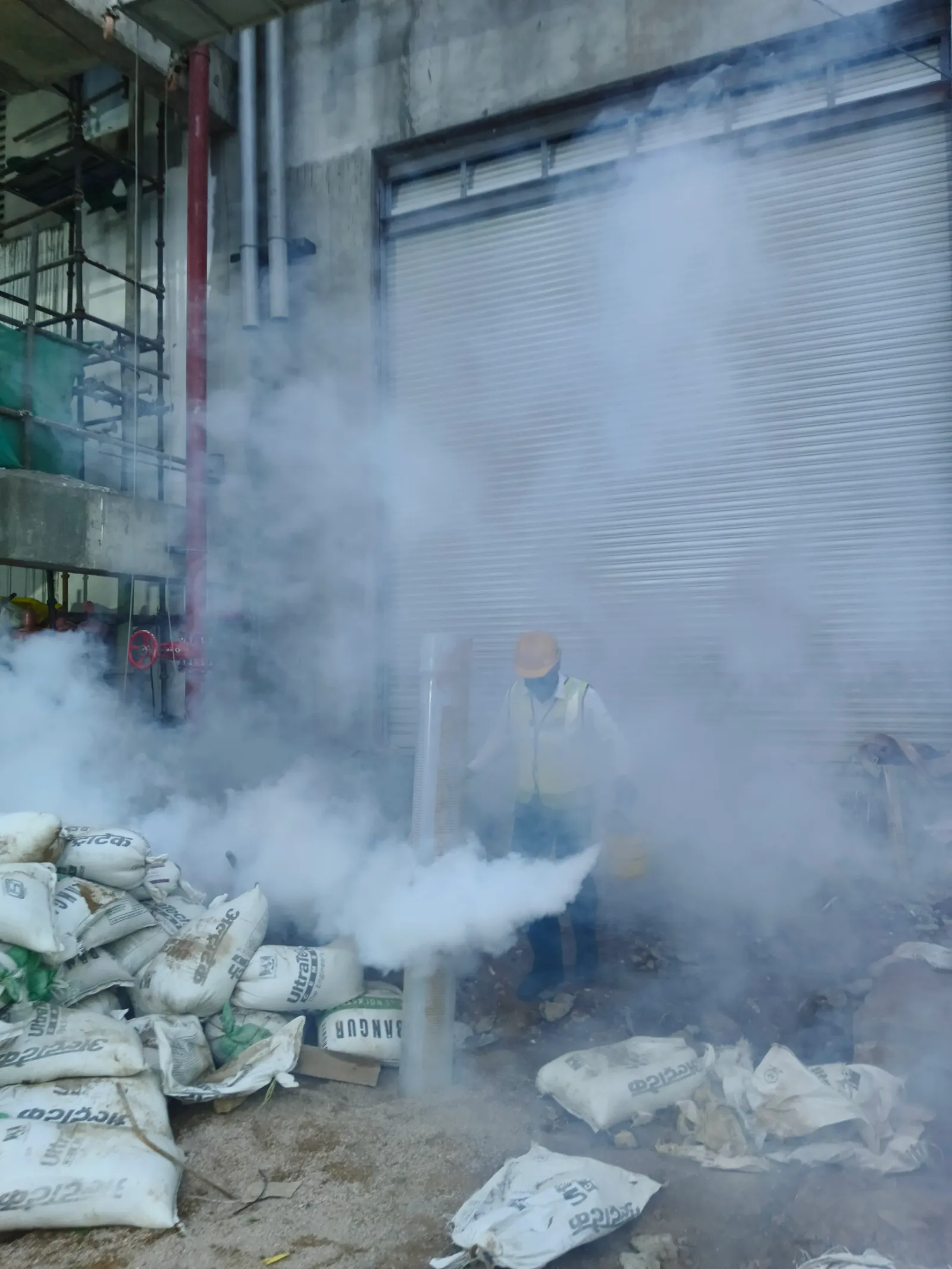 Technician using thermal fogging in an outdoor service area near Todabhim, Karauli.