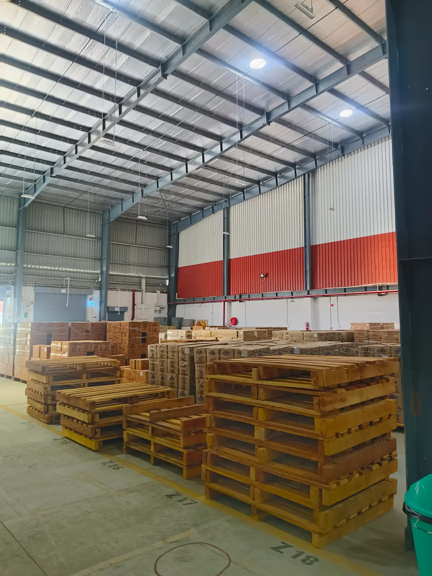 Commercial Fumigation service context: Wooden materials stored in a warehouse during wood-borer treatment.